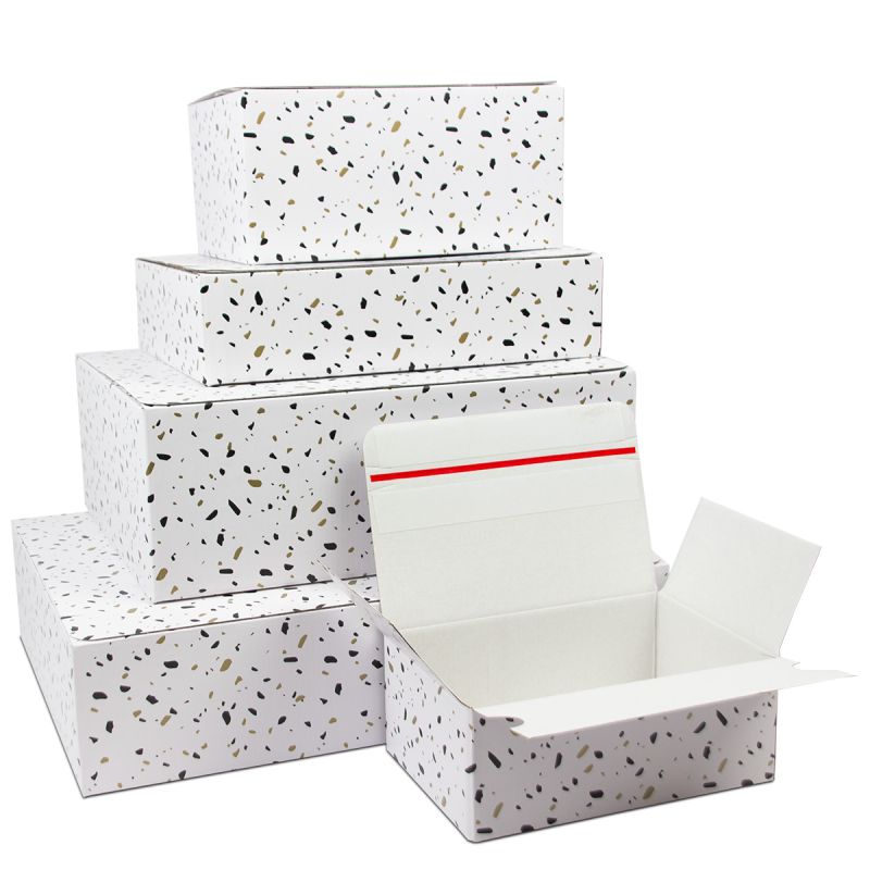 Confetti shipping boxes with auto-lock bottom and return strip